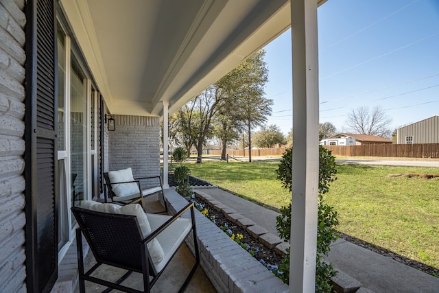 view of patio / terrace featuring fence