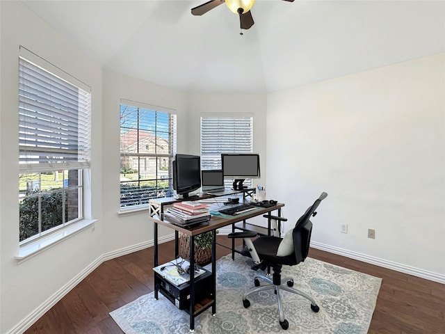 office space featuring ceiling fan, baseboards, vaulted ceiling, and wood finished floors