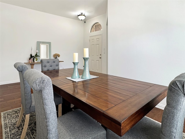 dining room with baseboards and wood finished floors