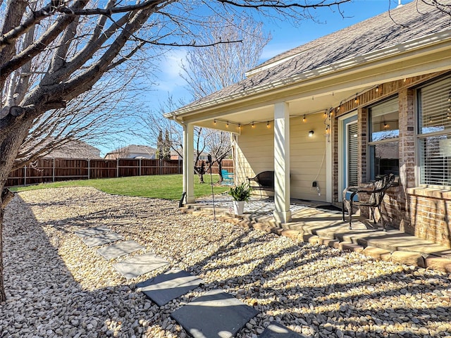 view of yard with a patio and a fenced backyard