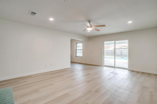 empty room with recessed lighting, baseboards, ceiling fan, and light wood finished floors