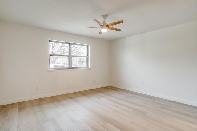 unfurnished room featuring light wood-style floors, ceiling fan, and baseboards