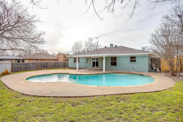 view of swimming pool with a fenced in pool, a patio area, a yard, and a fenced backyard