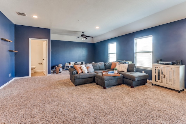 living area with visible vents, baseboards, carpet, recessed lighting, and a ceiling fan