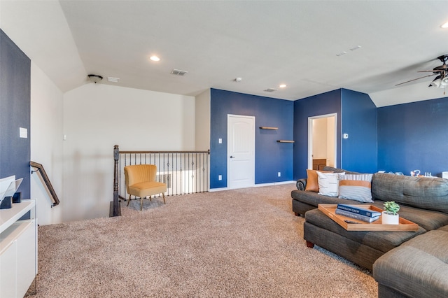 living room with visible vents, carpet floors, a ceiling fan, and vaulted ceiling