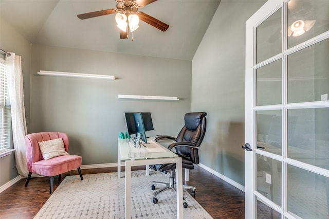 office area featuring vaulted ceiling, wood finished floors, and baseboards