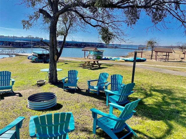 exterior space with a lawn and a water view