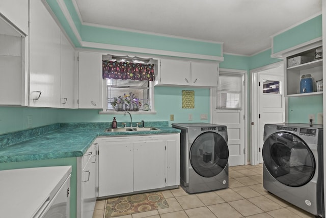 laundry area featuring cabinet space, ornamental molding, a sink, and independent washer and dryer