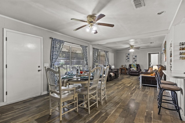 dining space featuring dark wood-type flooring, visible vents, and a ceiling fan