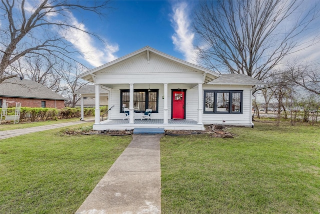 bungalow-style house featuring a porch and a front yard