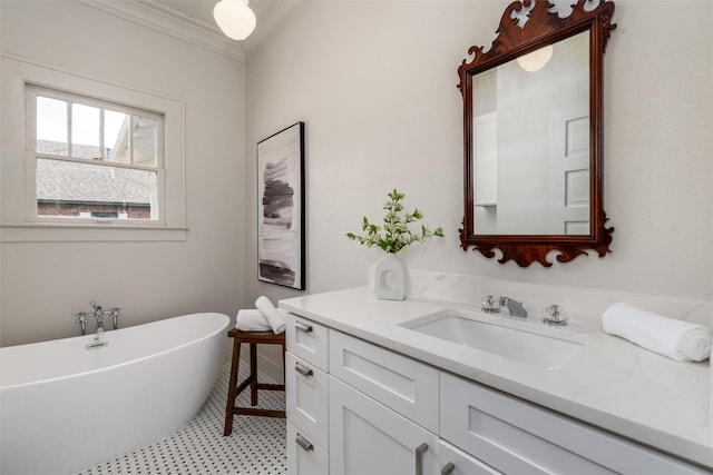 bathroom featuring a soaking tub, crown molding, and vanity