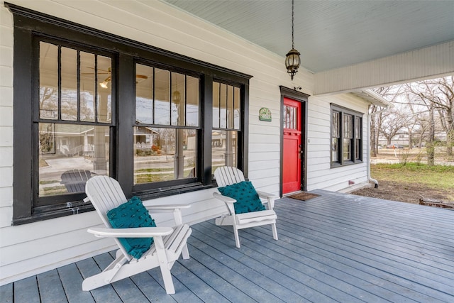 wooden terrace featuring covered porch