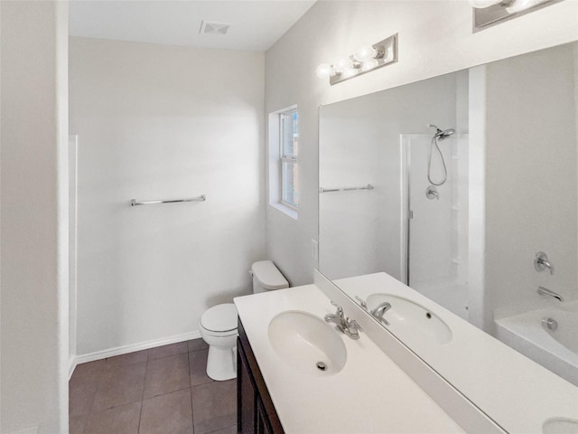 bathroom featuring baseboards, visible vents, toilet, tile patterned floors, and vanity