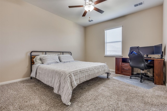 carpeted bedroom with a ceiling fan, visible vents, and baseboards