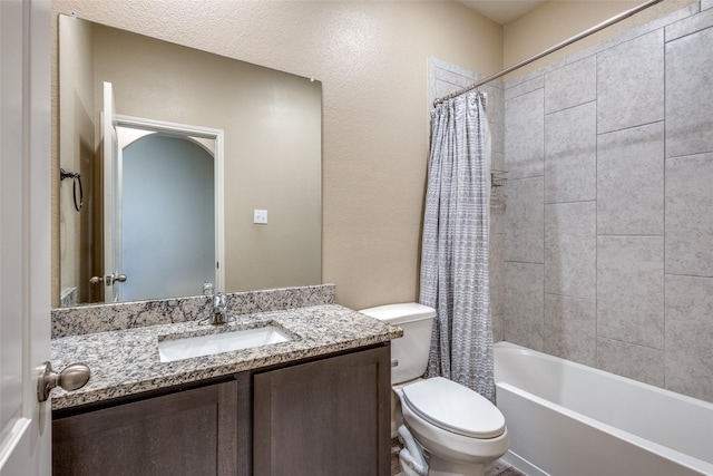 bathroom with toilet, shower / bath combo with shower curtain, and vanity