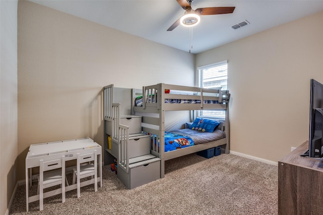 bedroom with carpet, visible vents, ceiling fan, and baseboards