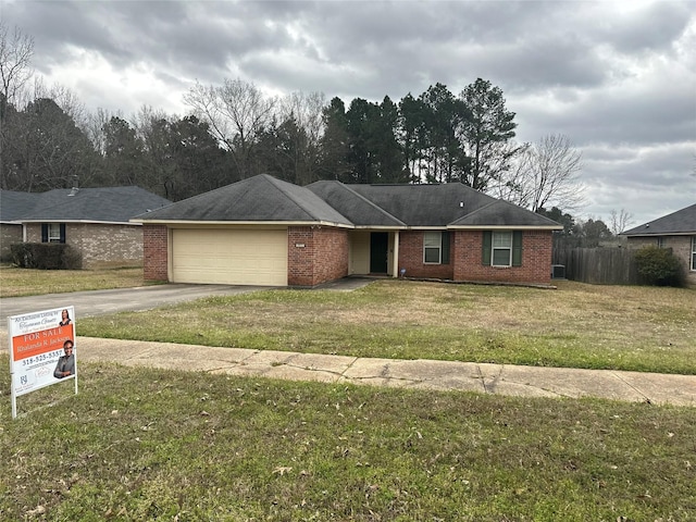 single story home with a garage, brick siding, concrete driveway, and a front lawn