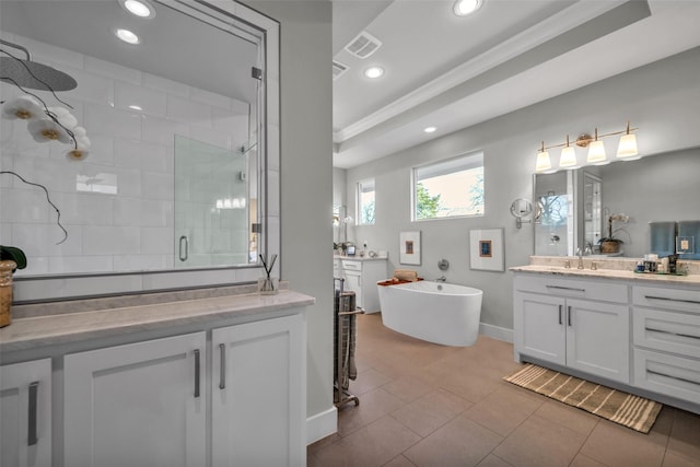 full bath with recessed lighting, visible vents, a shower stall, vanity, and a freestanding tub