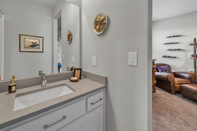 bathroom featuring connected bathroom and vanity