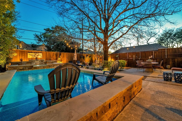 view of swimming pool featuring a fenced in pool, outdoor dining space, a patio area, and a fenced backyard