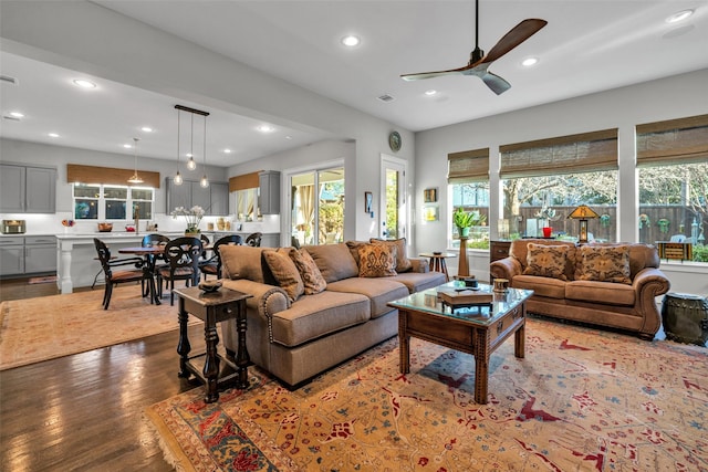 living room featuring a ceiling fan, wood finished floors, visible vents, and recessed lighting