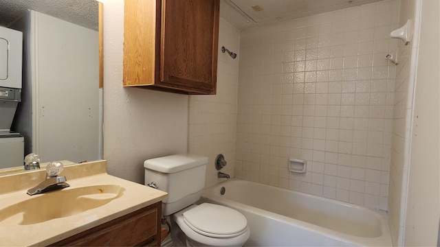 bathroom with shower / bath combination, a textured ceiling, toilet, and vanity