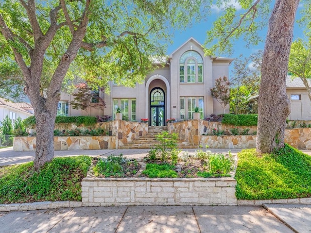 17704 Cedar Creek Canyon Dr, Dallas, TX 75252 - view of front of house featuring stucco siding and french doors