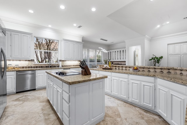 17704 Cedar Creek Canyon Dr, Dallas, TX 75252 - kitchen with recessed lighting, black electric cooktop, stainless steel dishwasher, a center island, and tasteful backsplash