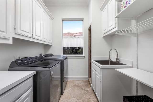 17704 Cedar Creek Canyon Dr, Dallas, TX 75252 - clothes washing area featuring crown molding, washer and clothes dryer, a sink, cabinet space, and baseboards