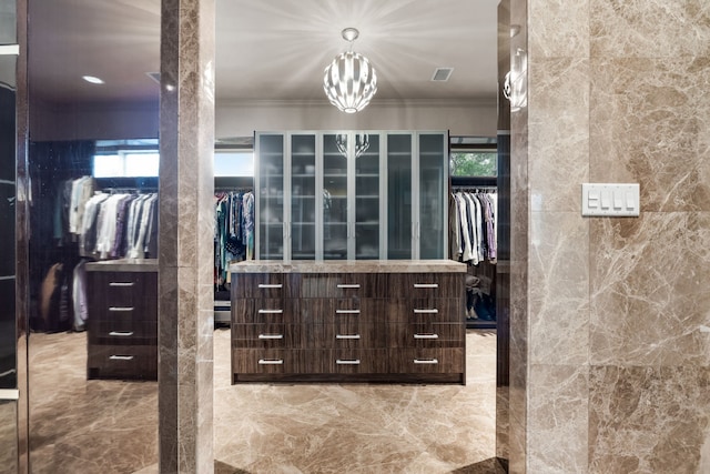 17704 Cedar Creek Canyon Dr, Dallas, TX 75252 - spacious closet featuring visible vents and a notable chandelier