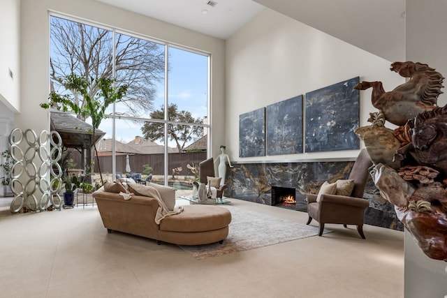 interior space with a lit fireplace