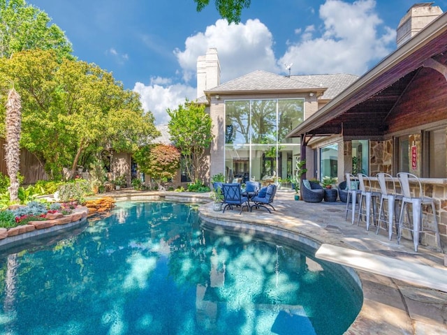 17704 Cedar Creek Canyon Dr, Dallas, TX 75252 - pool featuring outdoor dry bar, a diving board, and a patio