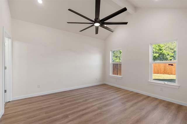 unfurnished room with a ceiling fan, beam ceiling, baseboards, and light wood finished floors