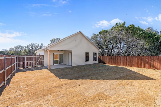 back of house with a patio area and a fenced backyard