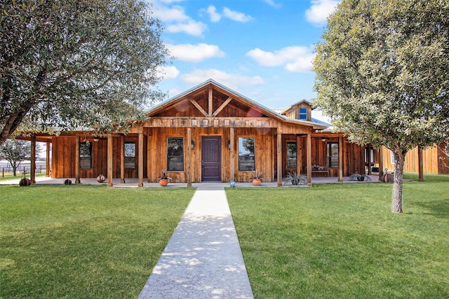 view of front of property with a front lawn and board and batten siding