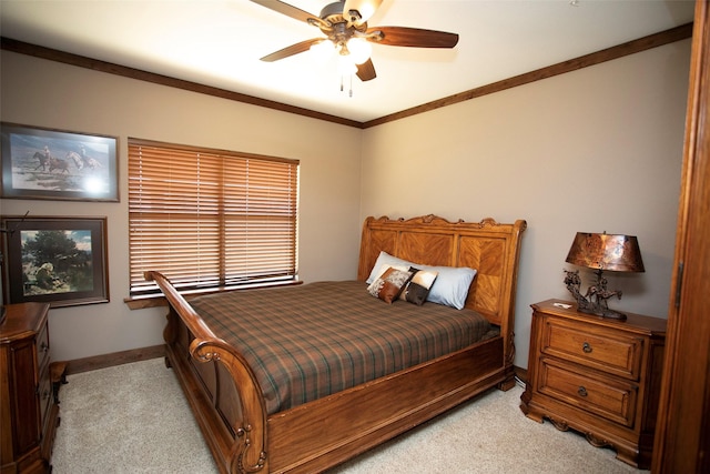 bedroom featuring ornamental molding, light colored carpet, ceiling fan, and baseboards