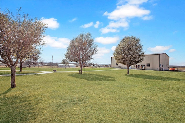 view of yard featuring an outbuilding and a pole building