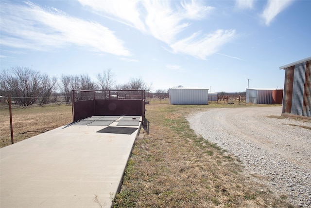 exterior space with fence and driveway