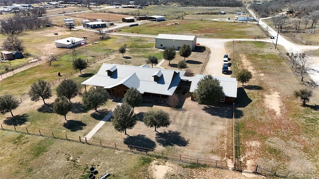 birds eye view of property with a rural view