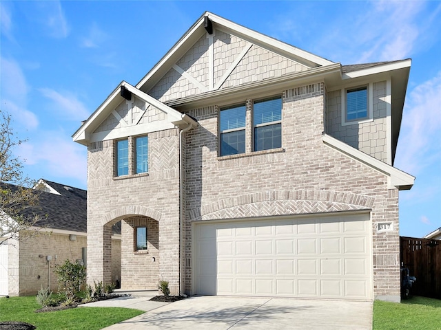 view of front of property with concrete driveway, brick siding, and an attached garage