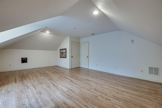 bonus room with recessed lighting, visible vents, baseboards, vaulted ceiling, and light wood-style floors