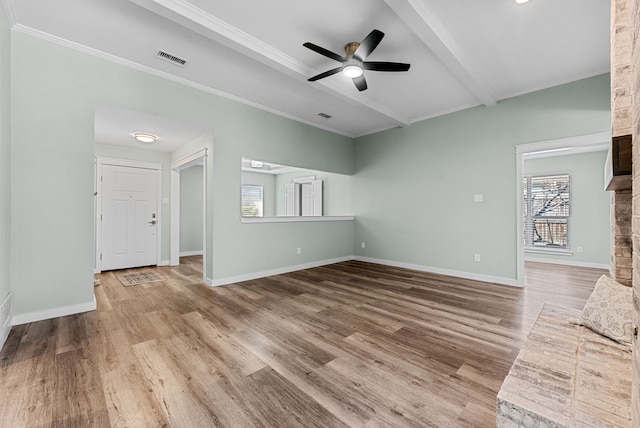 unfurnished living room with beam ceiling, wood finished floors, visible vents, and baseboards