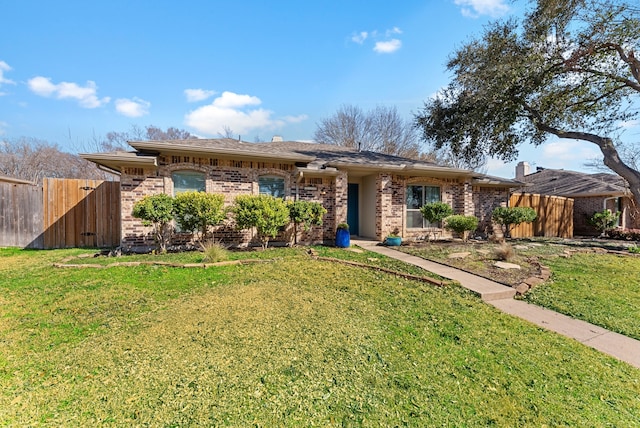 single story home featuring a front yard, a gate, brick siding, and fence