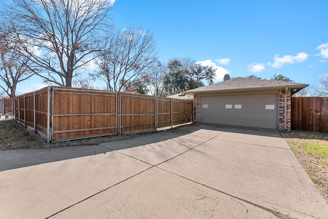 view of property exterior with a garage, a chimney, fence, and brick siding