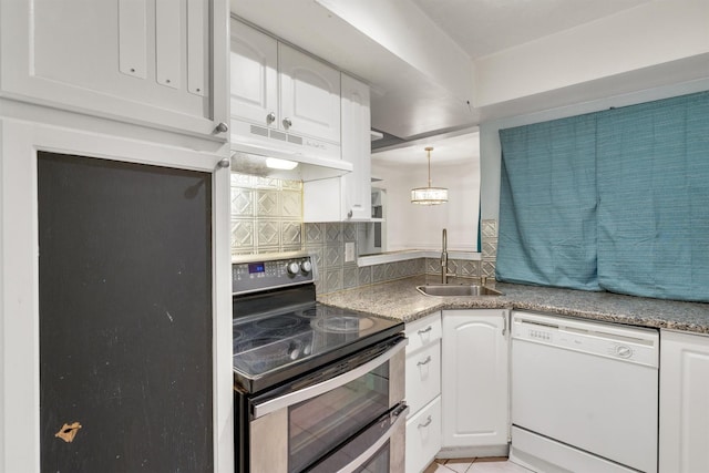 kitchen featuring decorative backsplash, white dishwasher, under cabinet range hood, double oven range, and a sink