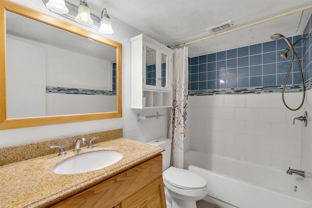 bathroom featuring shower / bath combination with curtain, visible vents, vanity, and toilet