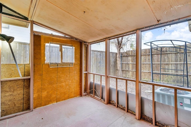 unfurnished sunroom with lofted ceiling