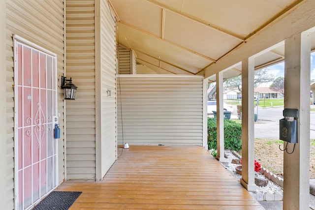 wooden terrace with a porch