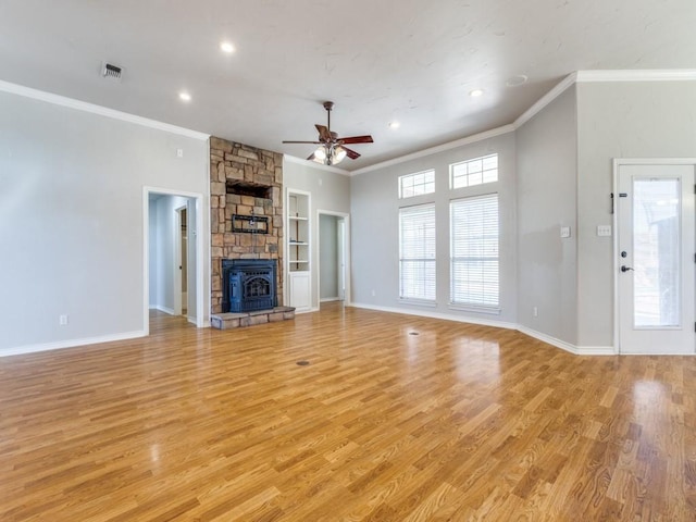 unfurnished living room with light wood-style flooring, visible vents, baseboards, and ornamental molding