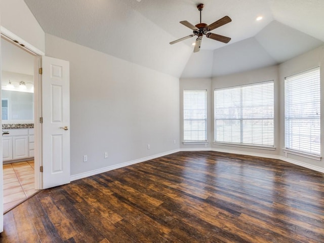 spare room featuring baseboards, lofted ceiling, ceiling fan, wood finished floors, and recessed lighting